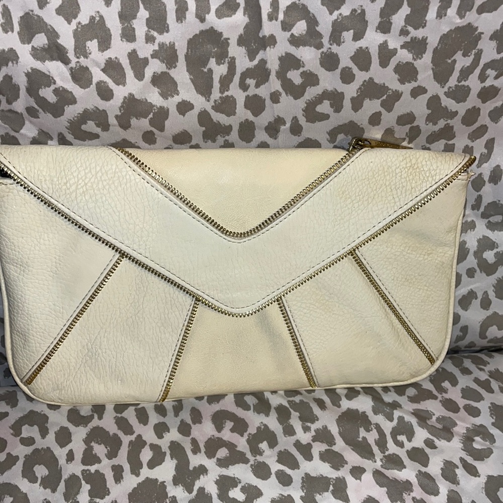 Worn Olivia and Joy two tone cream clutch purse with gold zipper tracks